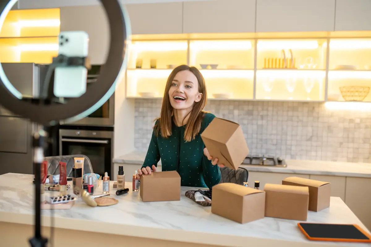 Young beautician. Long-haired cute beaitician conducting an online beauty workshop