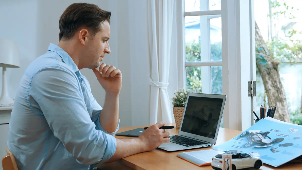 Car design engineer working on car prototype for automobile business synchronos