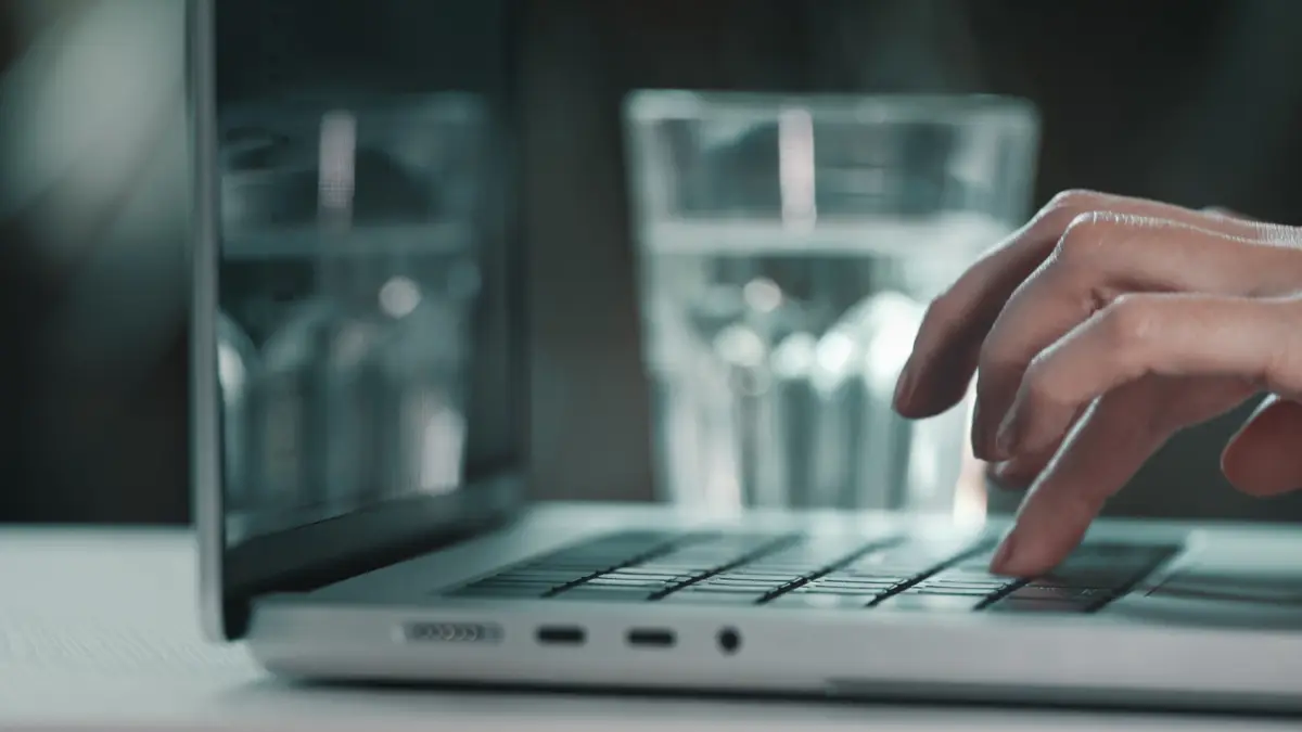Woman worker typing on laptop notebook keyboard