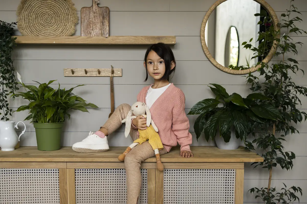 Child doing household activities indoors