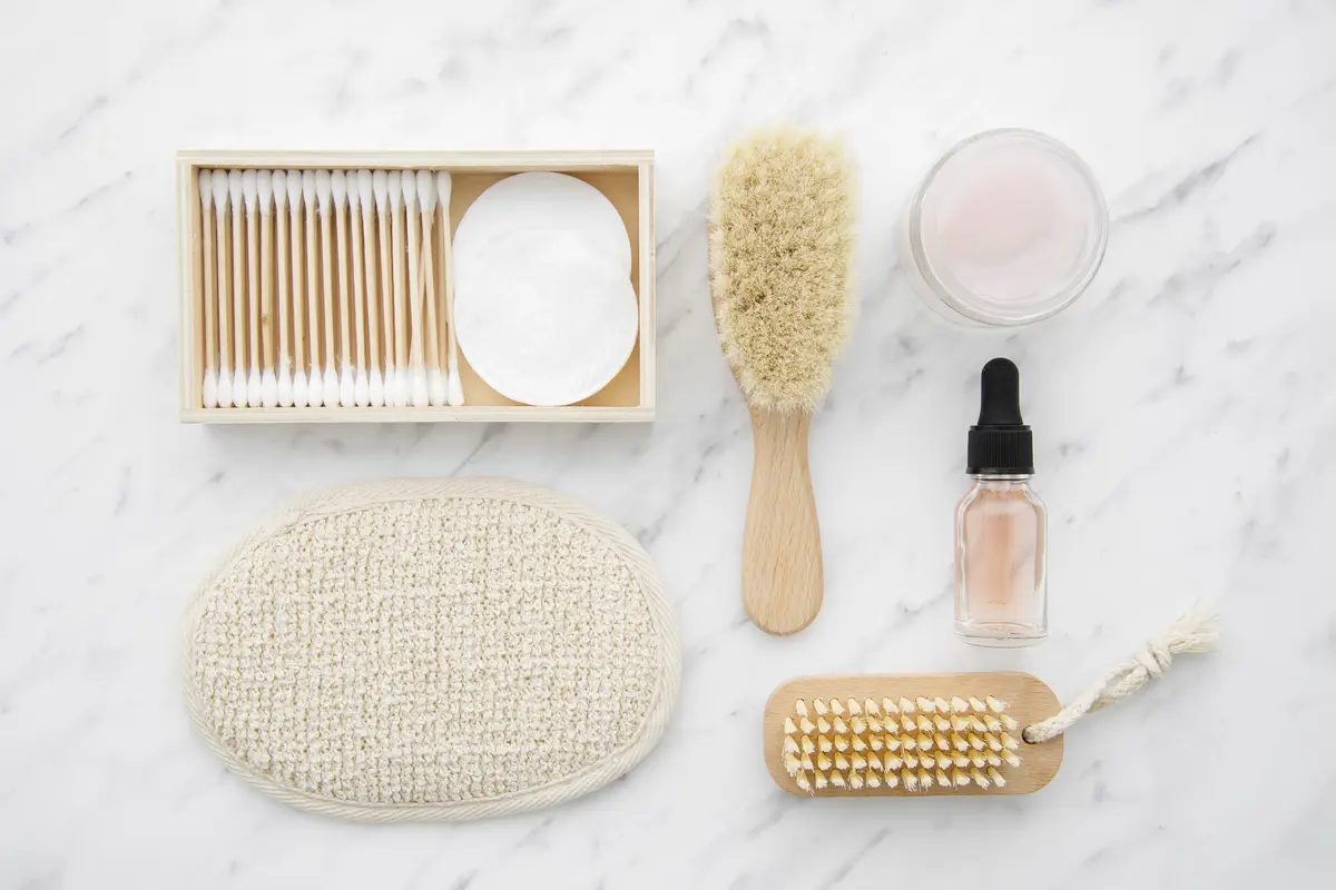 Flat lay arrangement with cosmetics on marble table