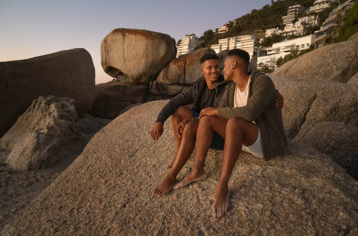 Gay male couple on the beach
