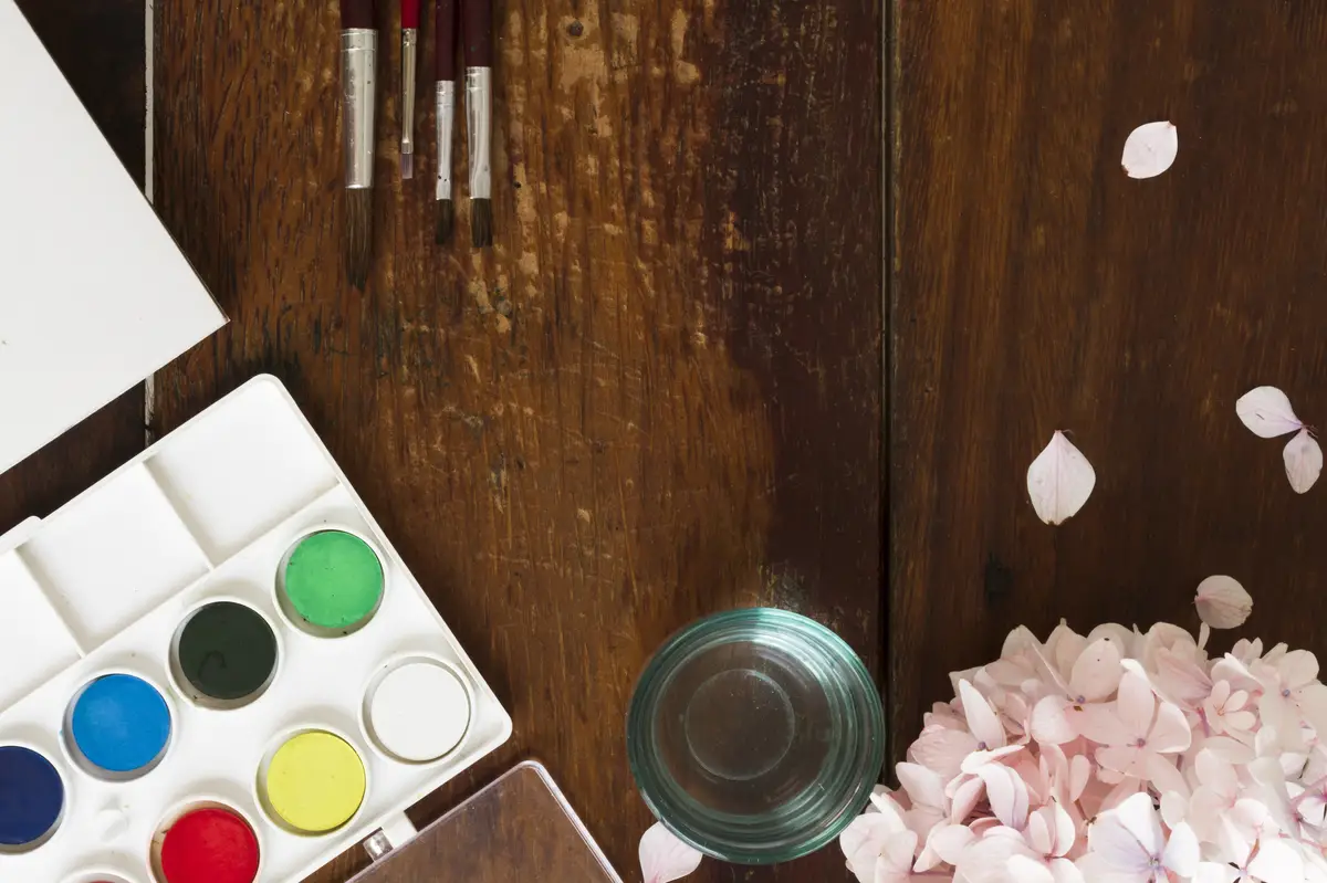 Painting watercolor and brushes at art workplace 