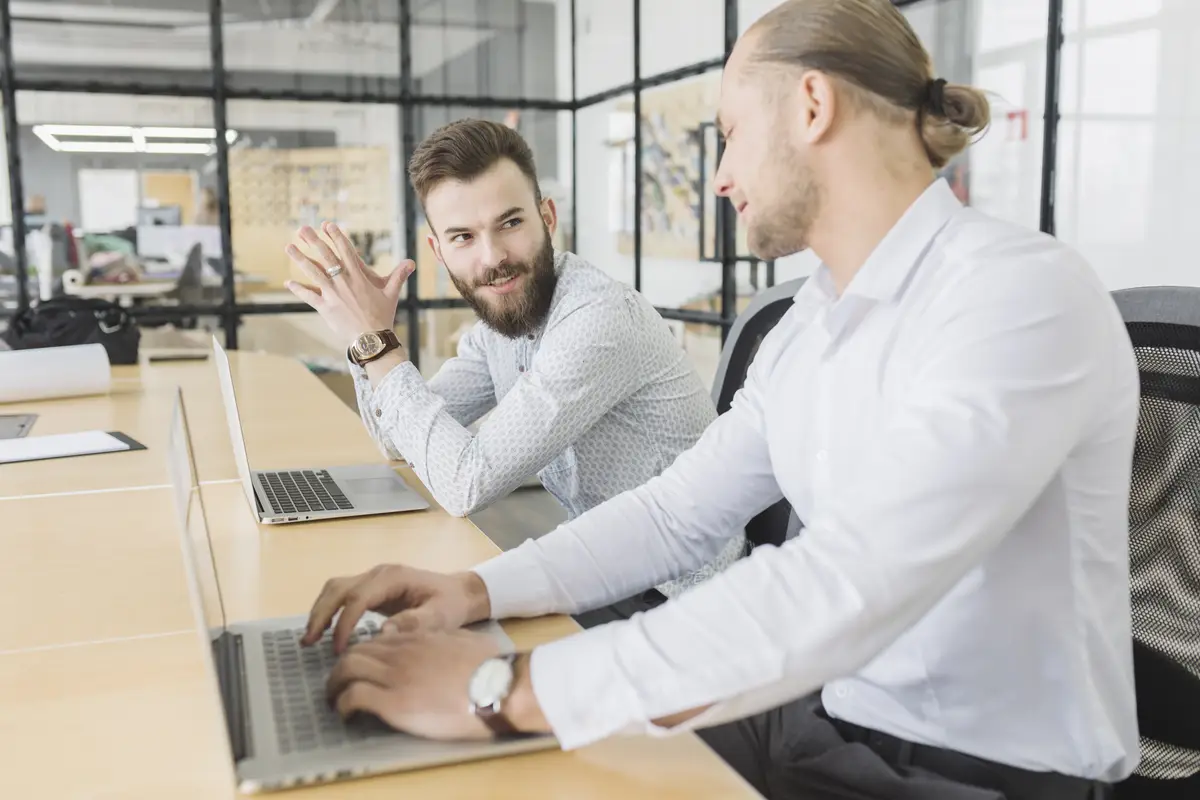 Business people working with laptop in office
