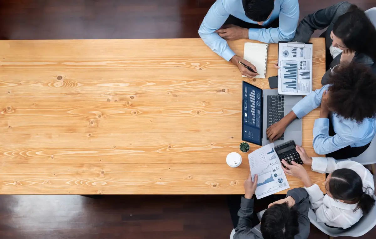 Panorama top view multiracial analyst team use BI dashboard display on laptop screen analyzing financial data for strategic decision Fintech analyzes marketing indicators Concord