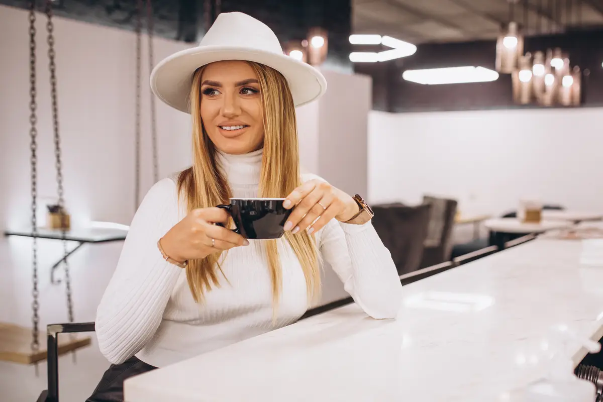 Woman drinking coffee in a cafe