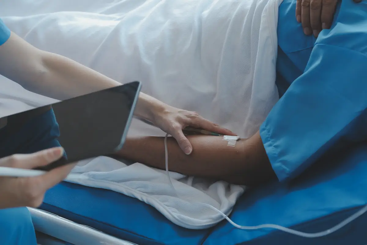 Injured patient showing doctor broken wrist and arm with bandage in hospital office or emergency room Sprain stress fracture or repetitive strain injury in hand Nurse helping customer First aid