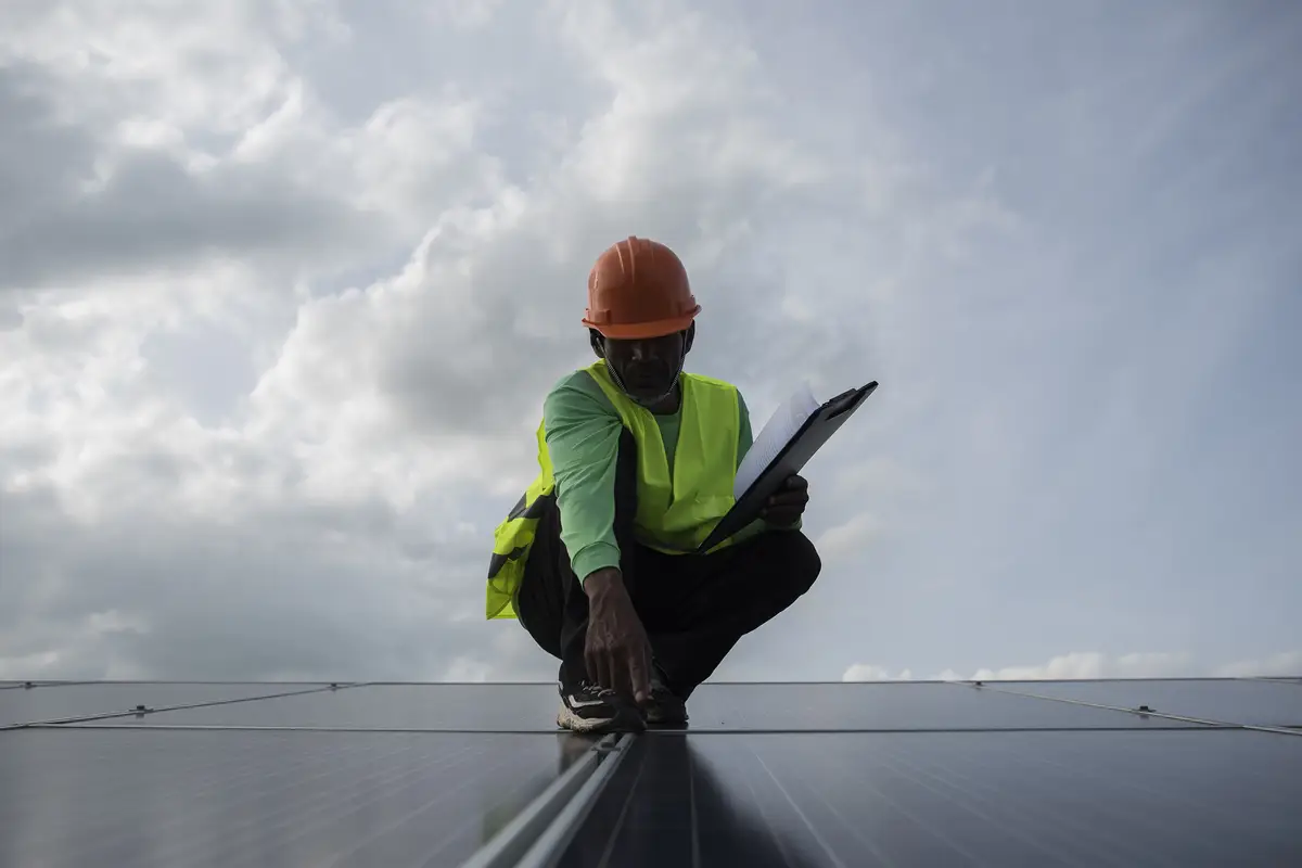 Technician engineer checks the maintenance of the solar cell panels.