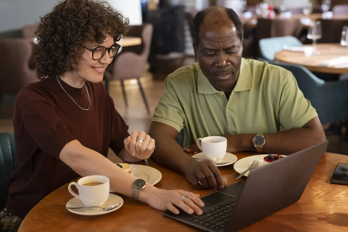 Front view friends sitting at restaurant