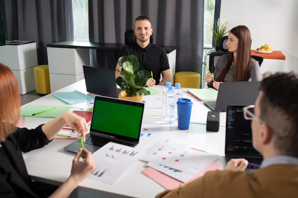 Office workers at the table discussing business strategies