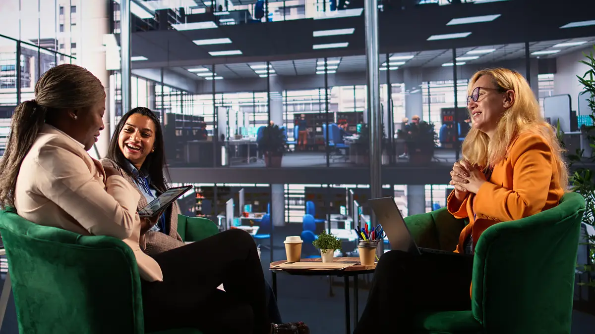 Ambitious businesswomen collaborating in a corporate office