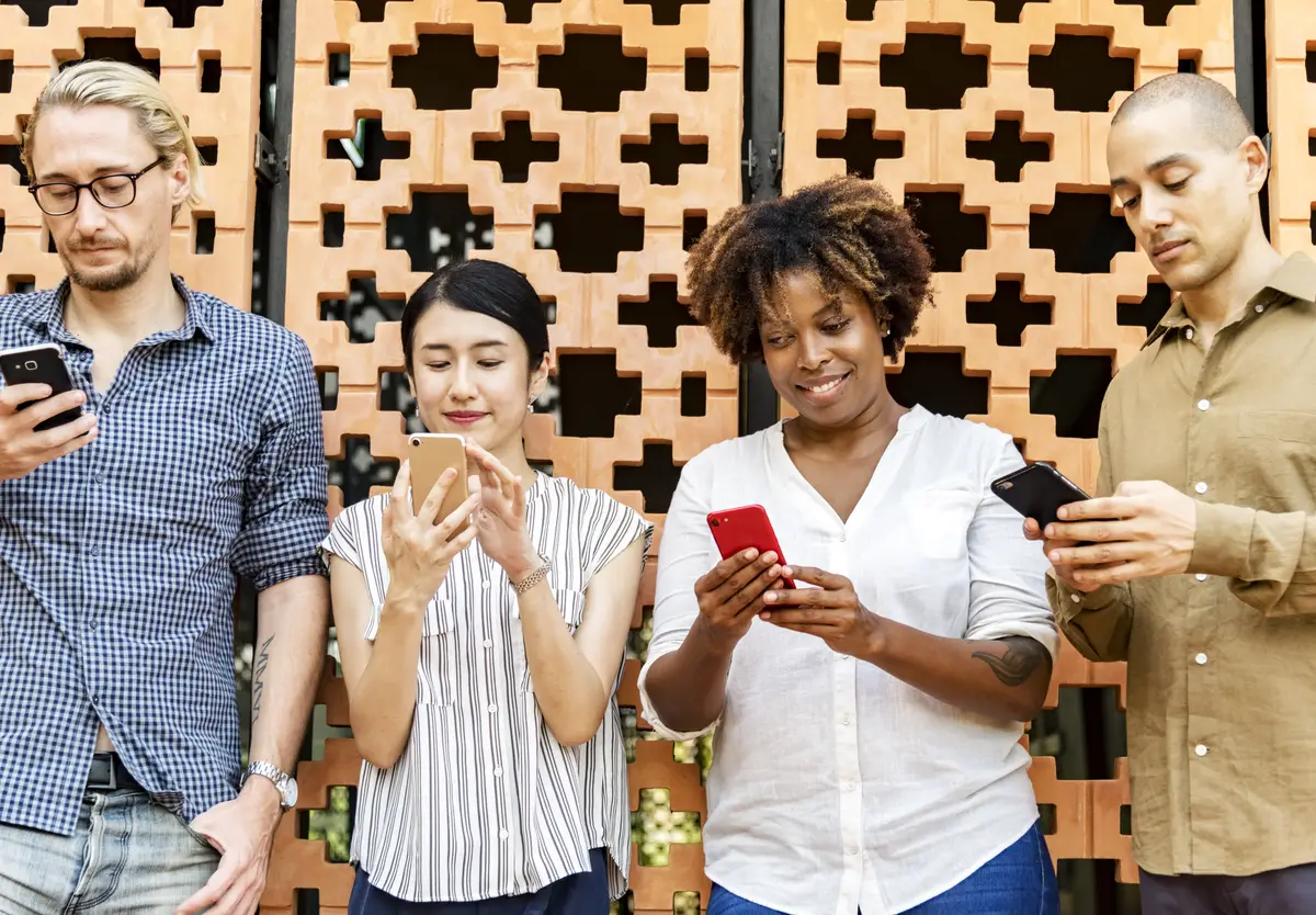 Group of diverse people using smartphones