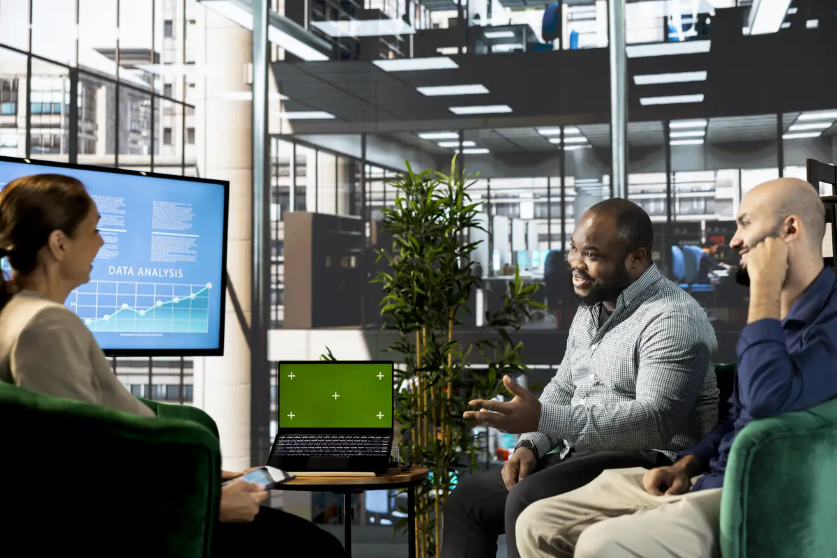 Mockup notebook used by multiracial employees doing brainstorming in startup