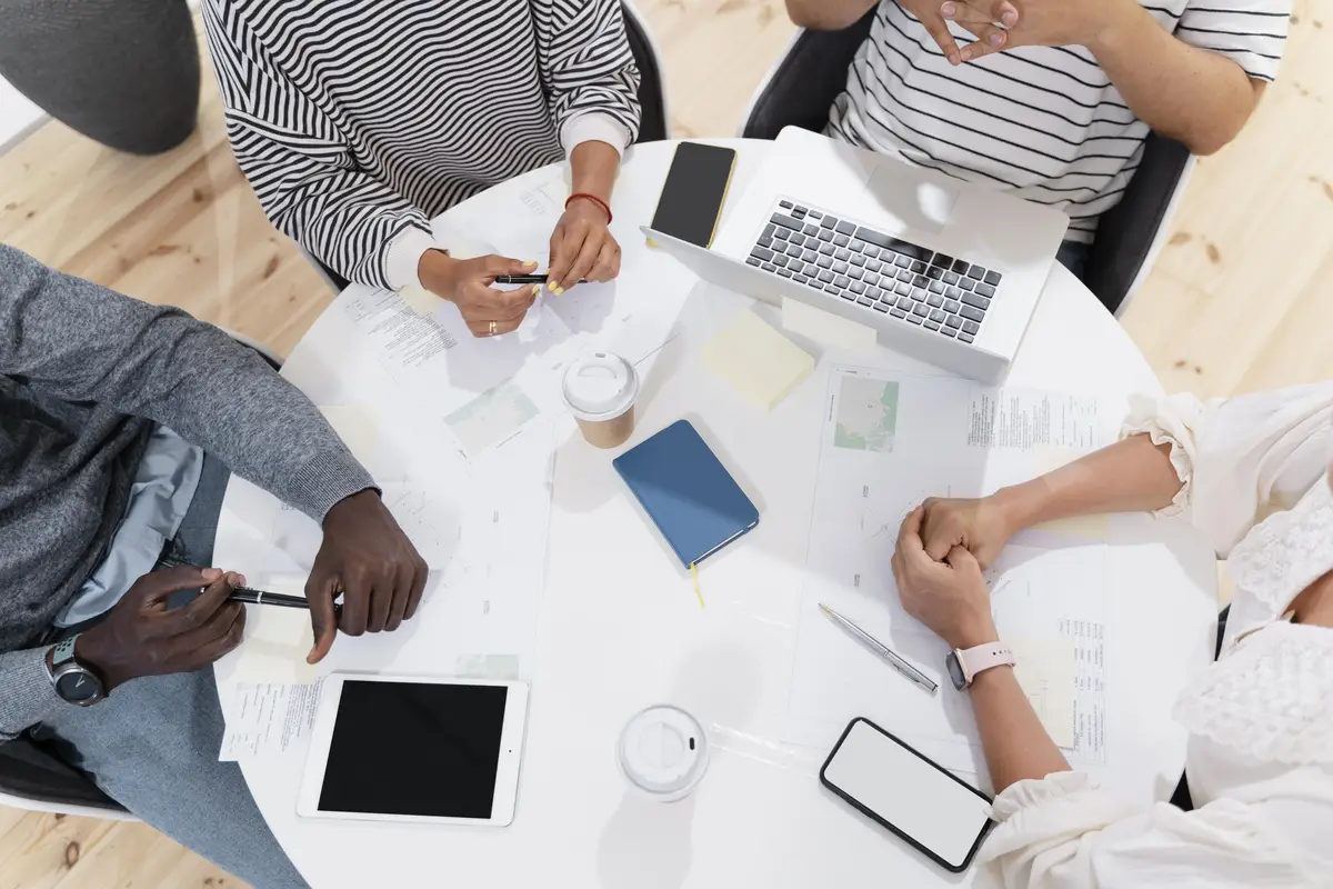 Close up on young colleagues hands in a meeting