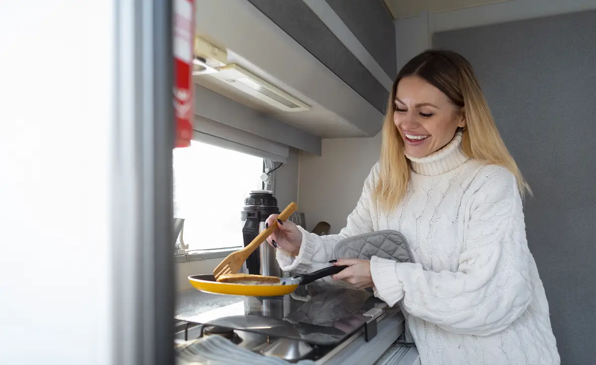 Medium shot smiley woman cooking