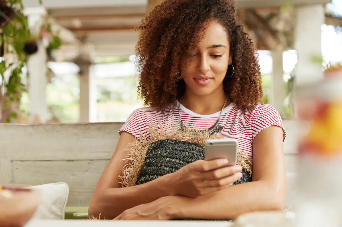 Beautiful African-American woman in cafe
