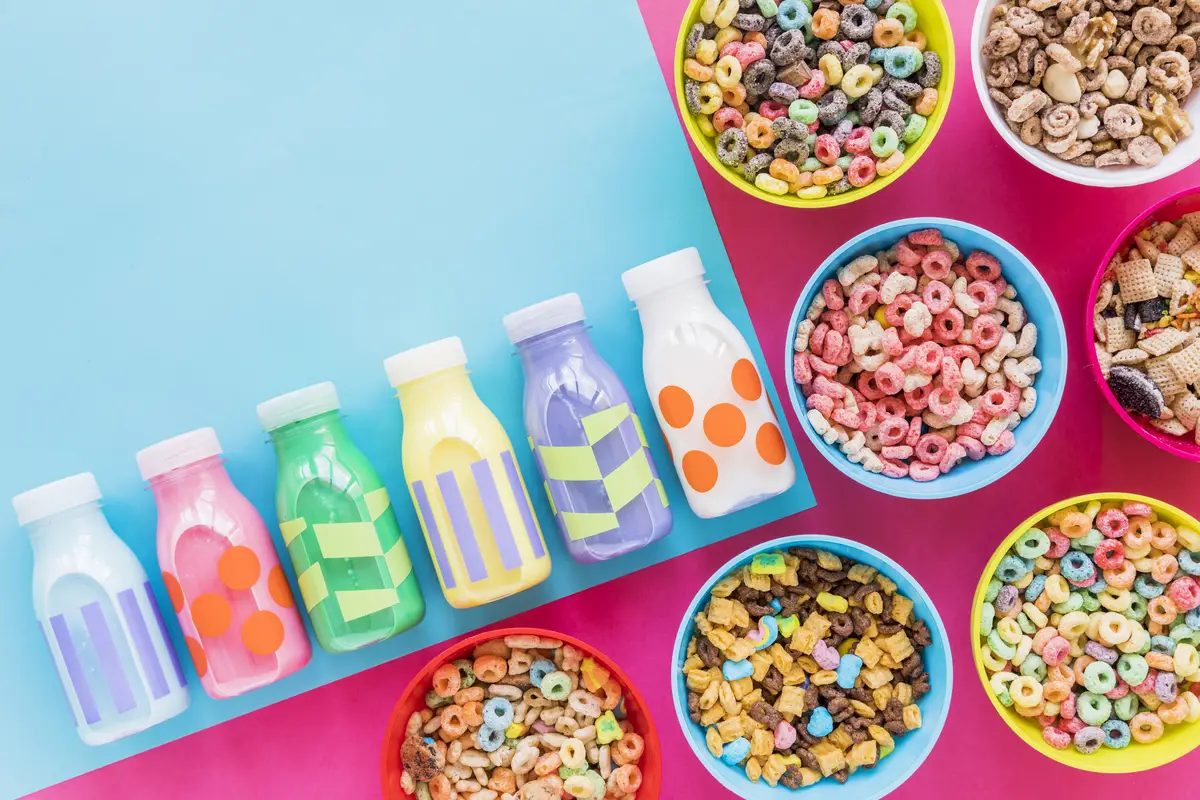 Bowls of cereals with small milk bottles