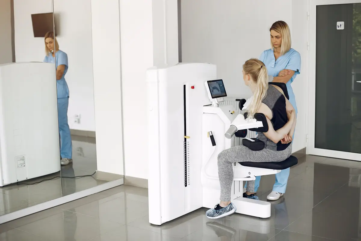 Woman at physiotherapy making physical exercises with qualified therapist