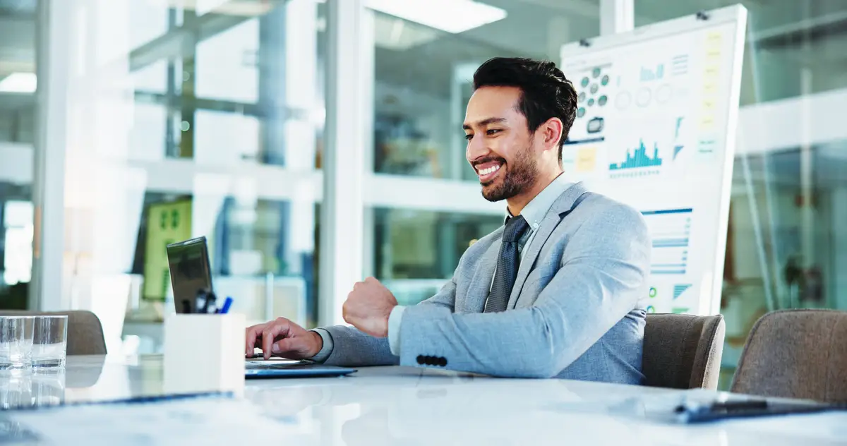 Office businessman and smile with laptop for accountant auditing and online for investment research Career male person and financial consultant with tech for finance agency information or review