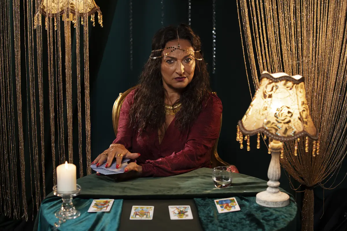 Fortune teller with tarot cards medium shot