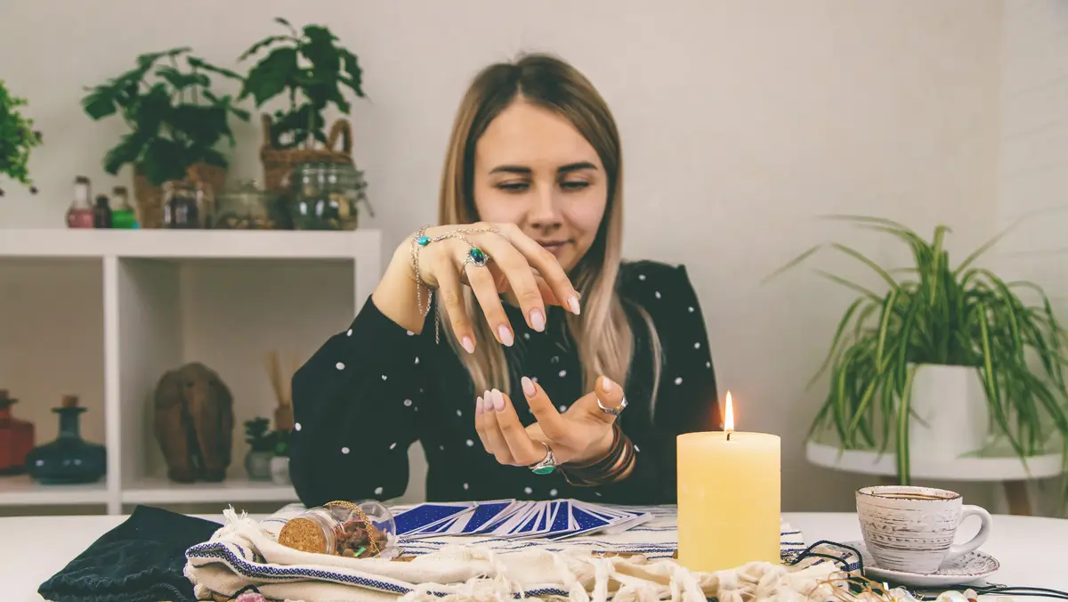 A fortune teller reads with tarot cards Selective focus
