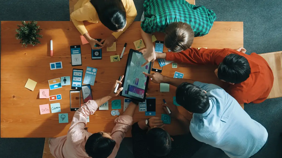Top view of software developer team looking Ux design from tablet Convocation