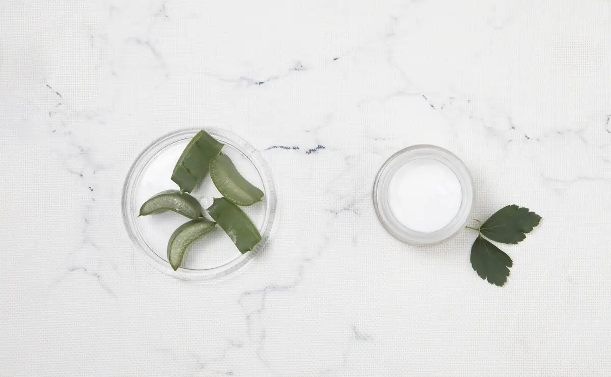 Flat lay body cream on marble background