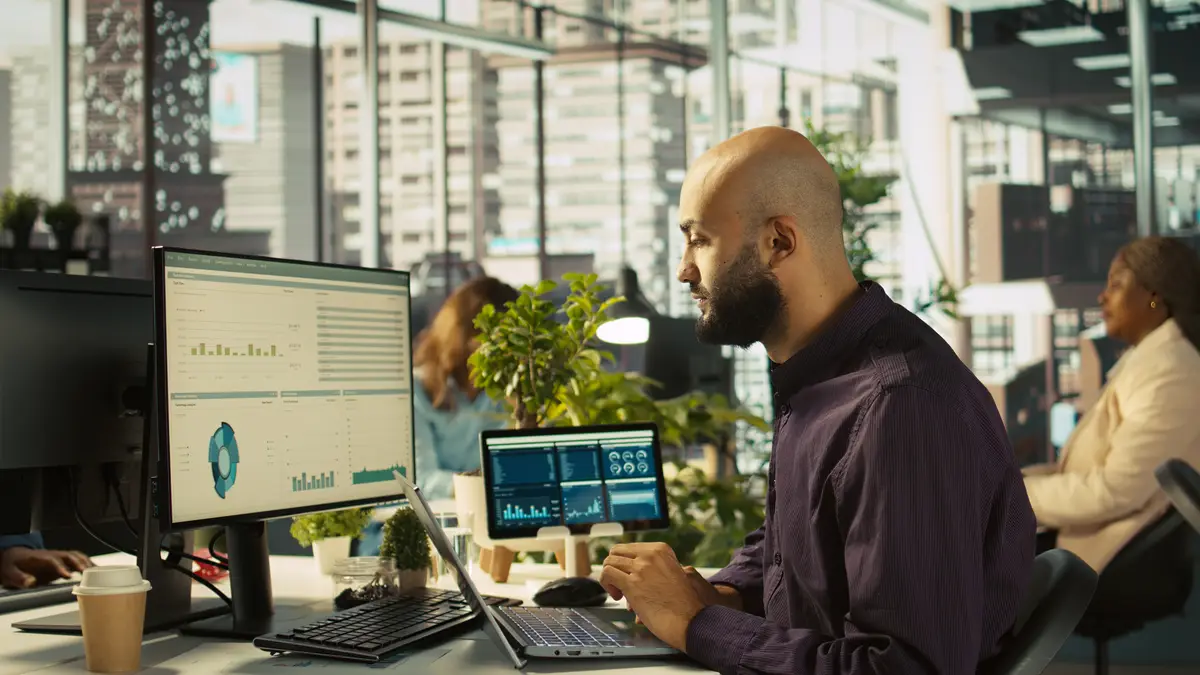 Jolly bookkeeper at work happy after finishing verifying business documents