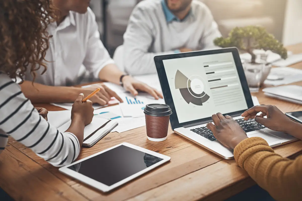 Group laptop screen and tablet in data analysis for business in office as web developer in brainstorming People tech and digital agency for meeting growth or research for brand design in company