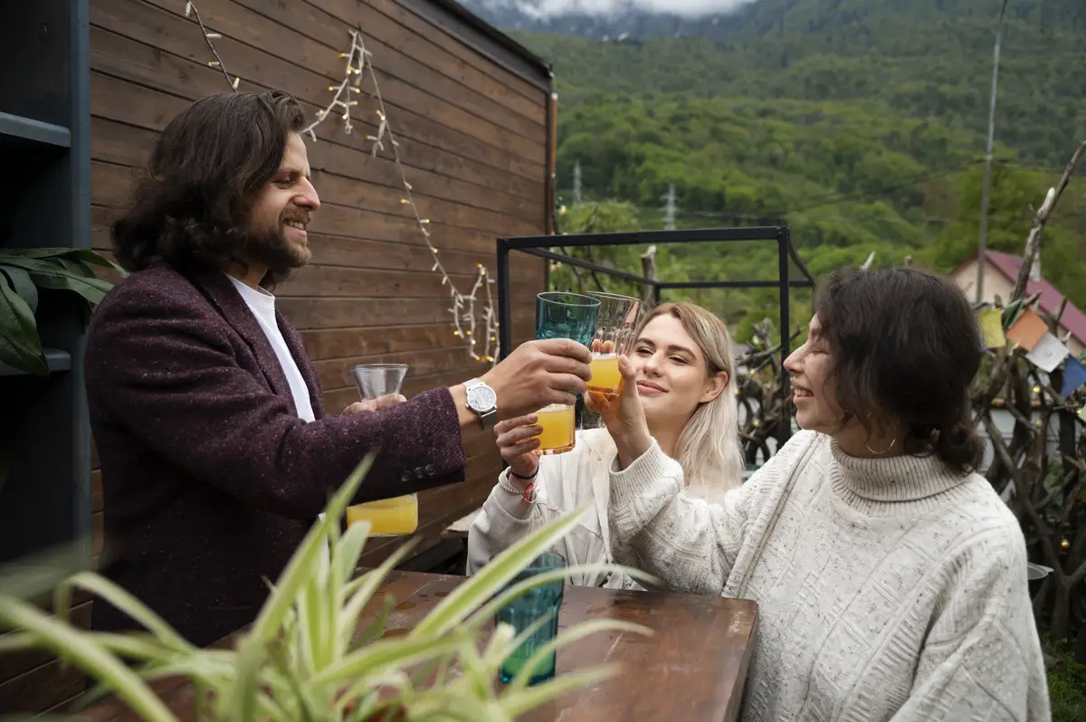 Medium shot people clinking glasses