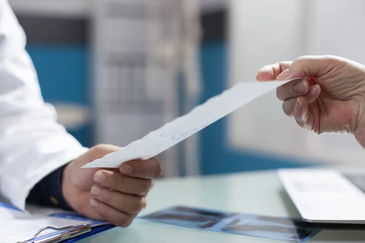 White person receives prescription paper