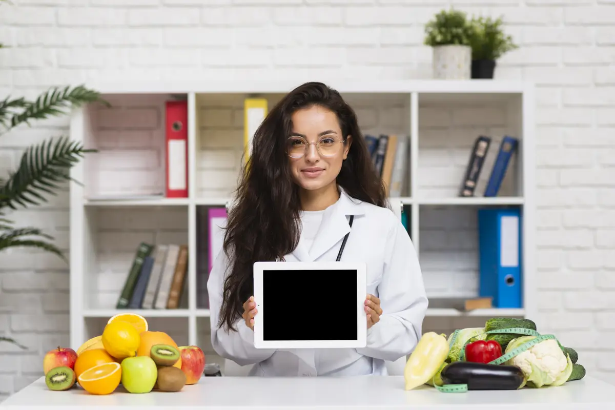 Medium shot young doctor with tablet mock-up