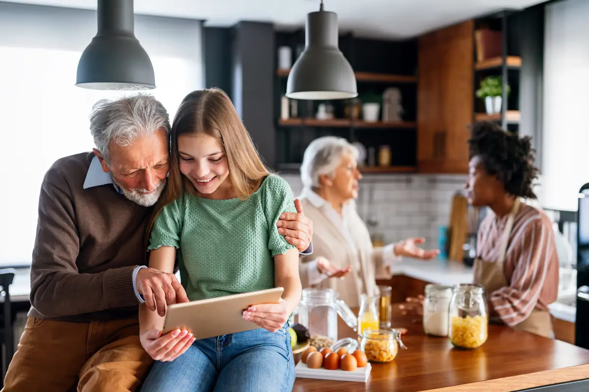 Portrait of happy multigeneration multiethnic family having fun in kitchen at home