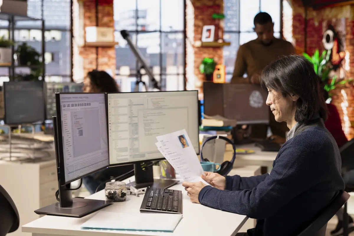 Tech startup company senior HR manager looking at CVs