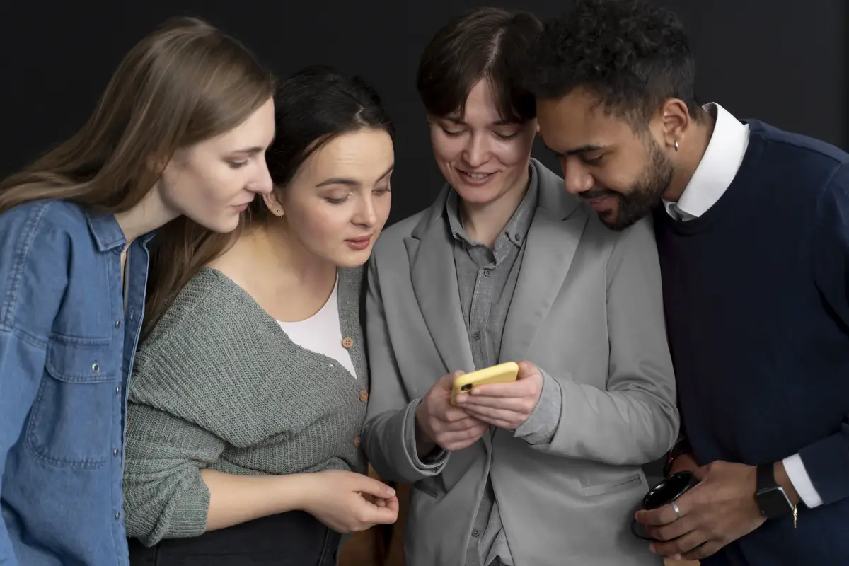 Trans person working at office with colleagues
