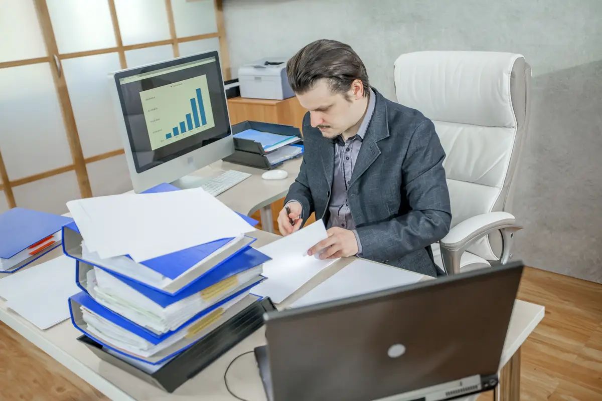 Young businessman working from his office - the concept of hard work