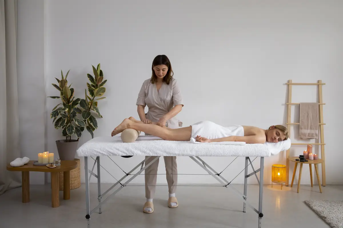 Woman getting a back massage from female masseur