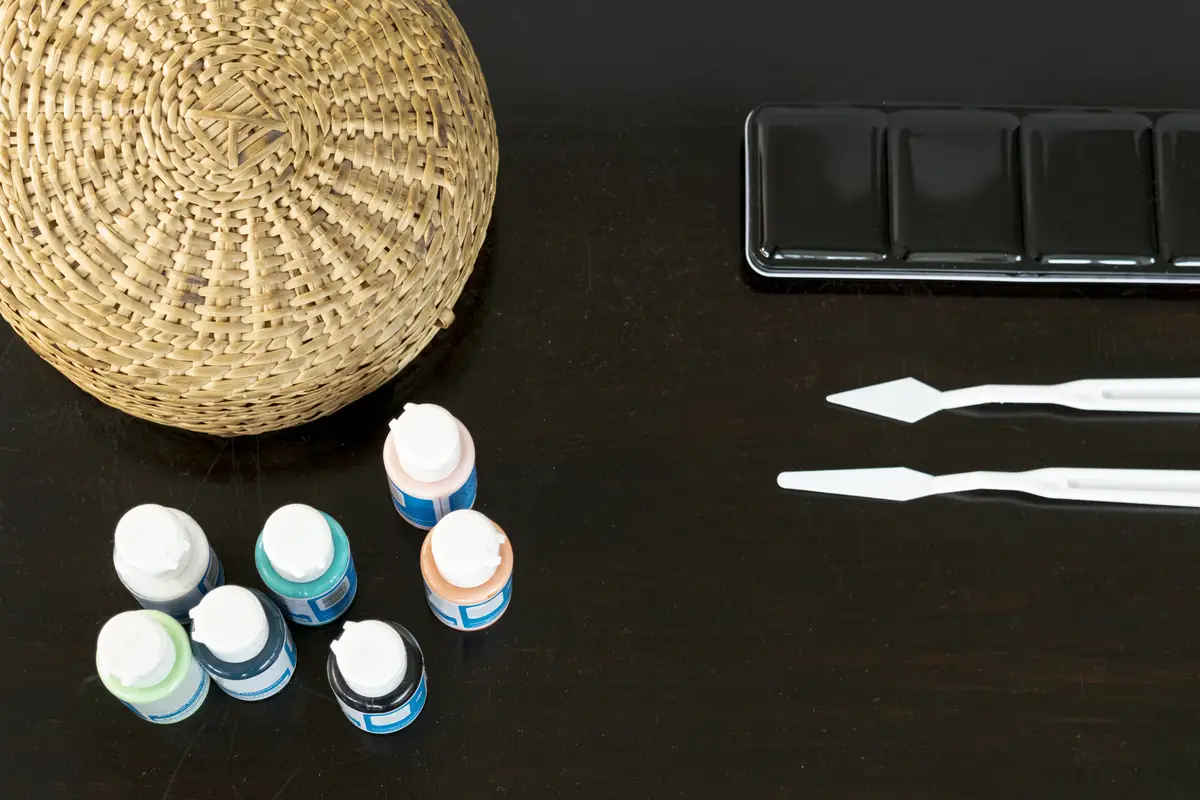 Paint supplies on black background