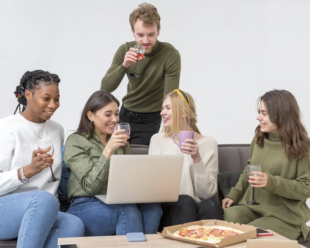 Low angle friends having pizza for lunch