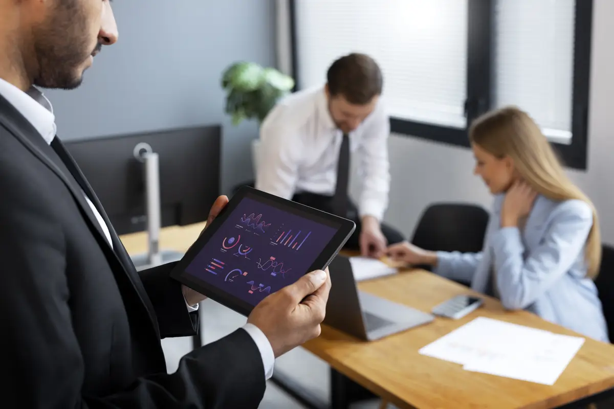 Person looking over finance graphs