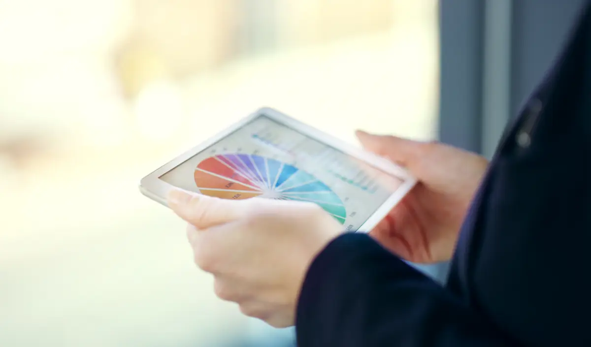 She has access to all her information on one device Cropped shot of an unrecognizable young businesswoman working on a digital tablet while standing on her office balcony