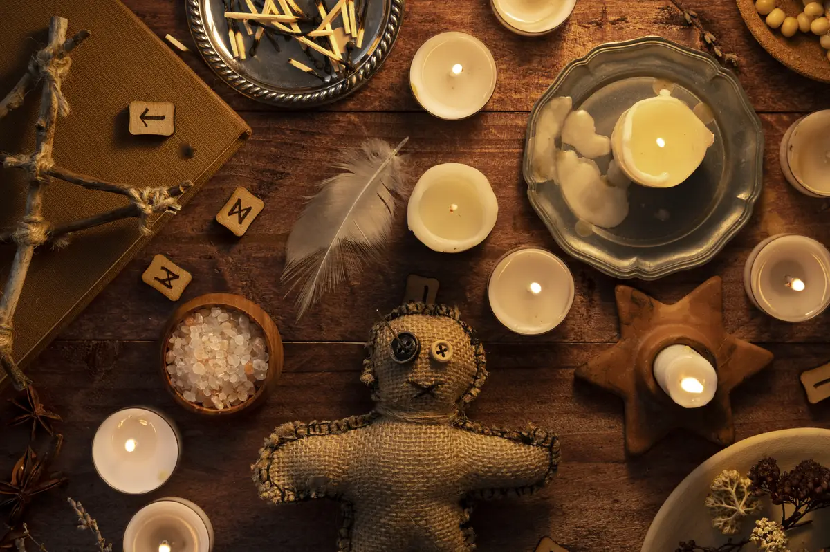 Voodoo doll and esoteric items top view