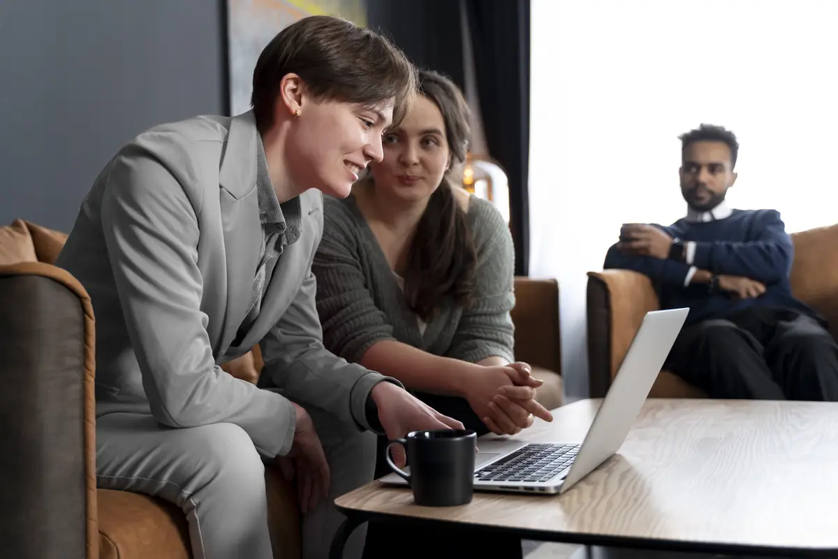 Trans person working at office with colleagues