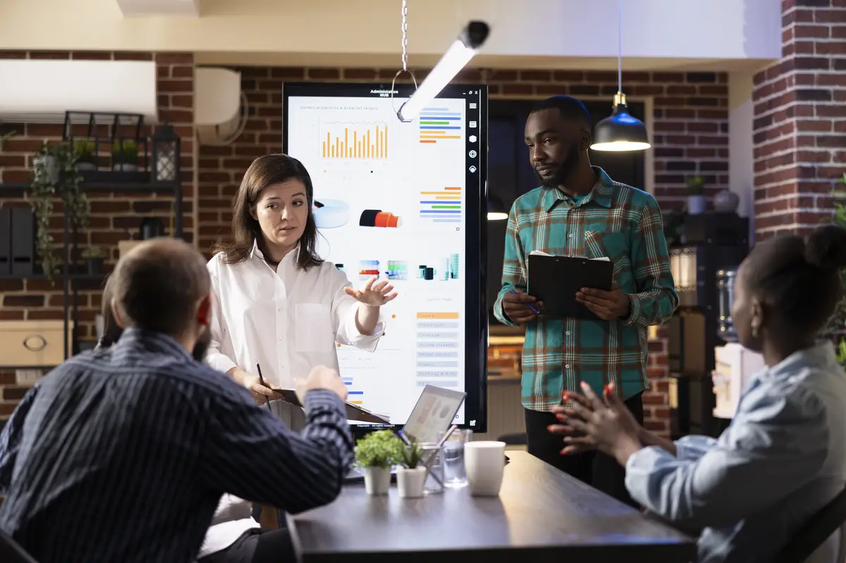 Business executives reviewing marketing trends