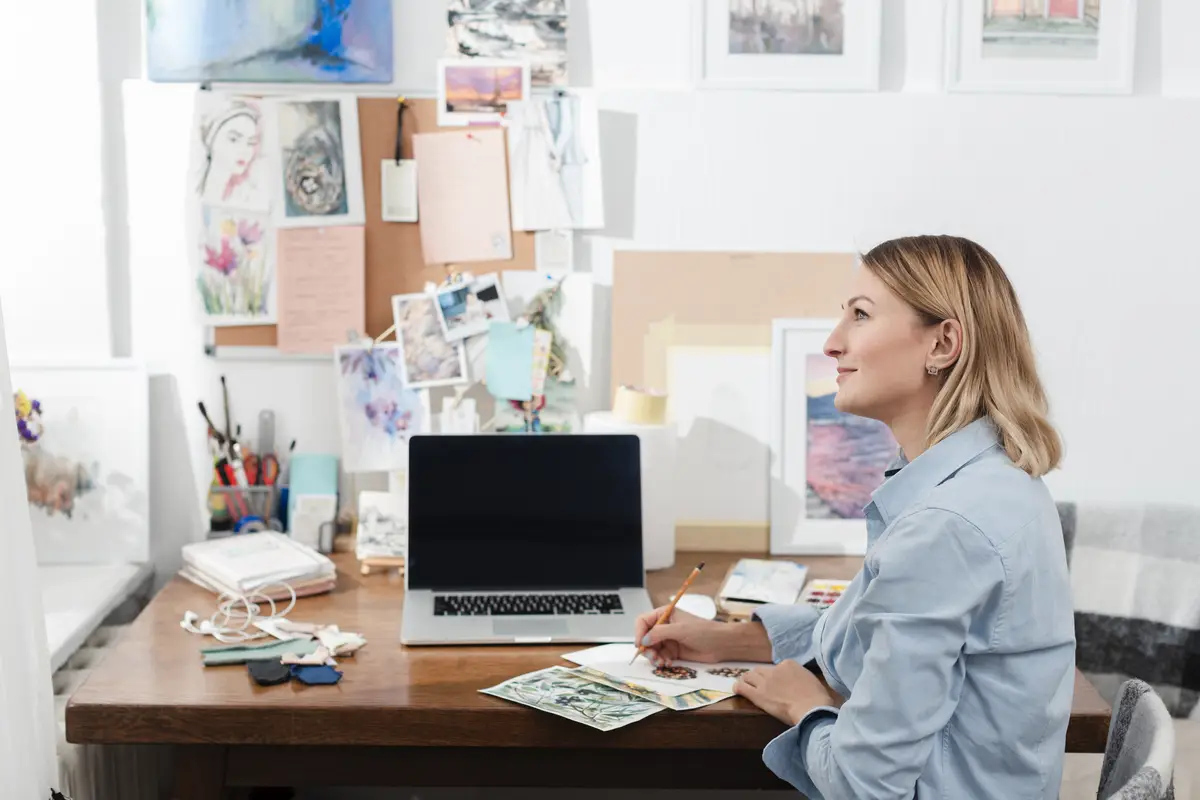Creative artist sitting at desk