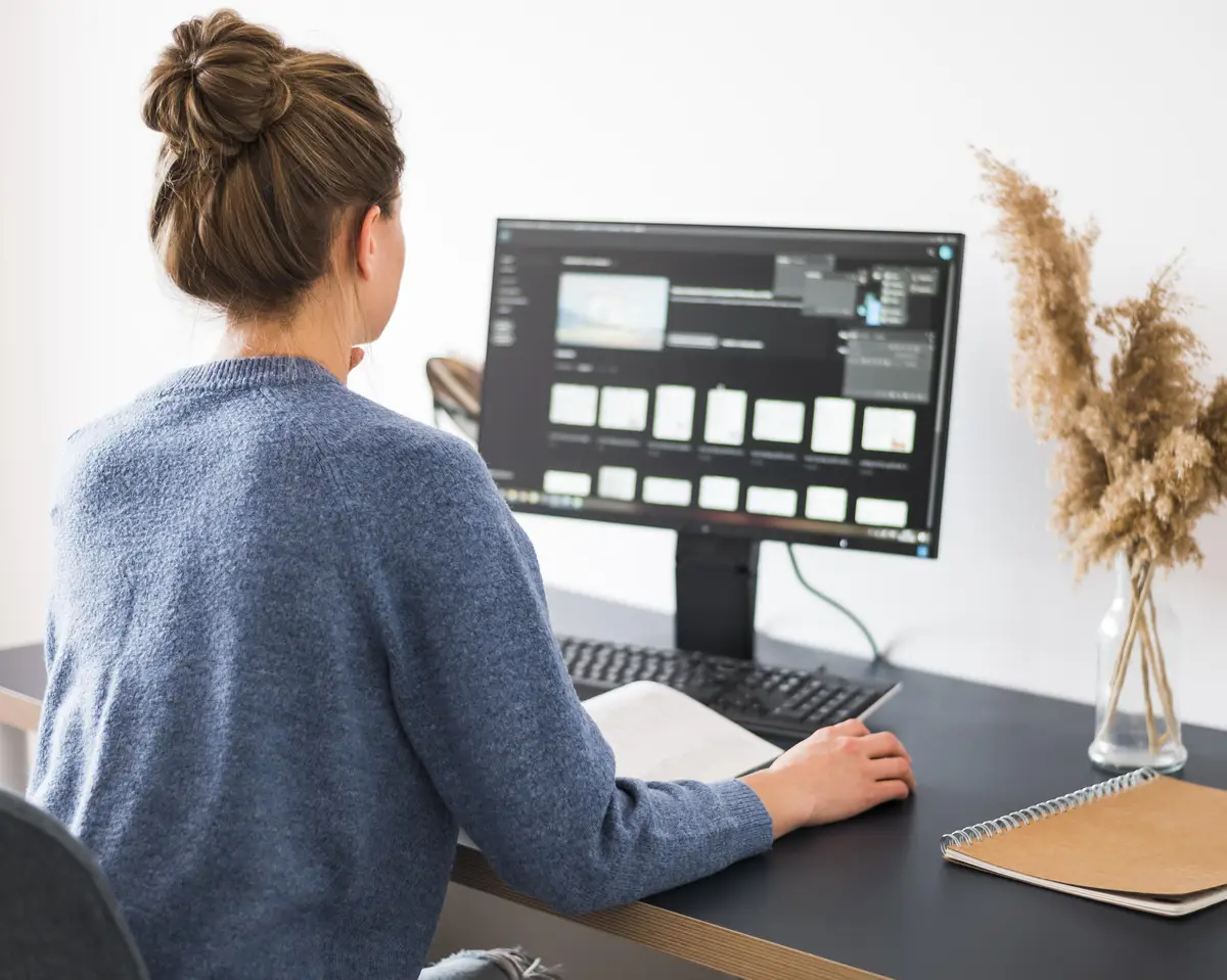 Back view of woman working at desk