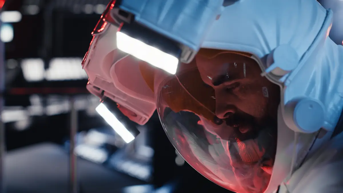 Astronaut pressing wrist display to send sos signal after onboard incident triggers critical alert