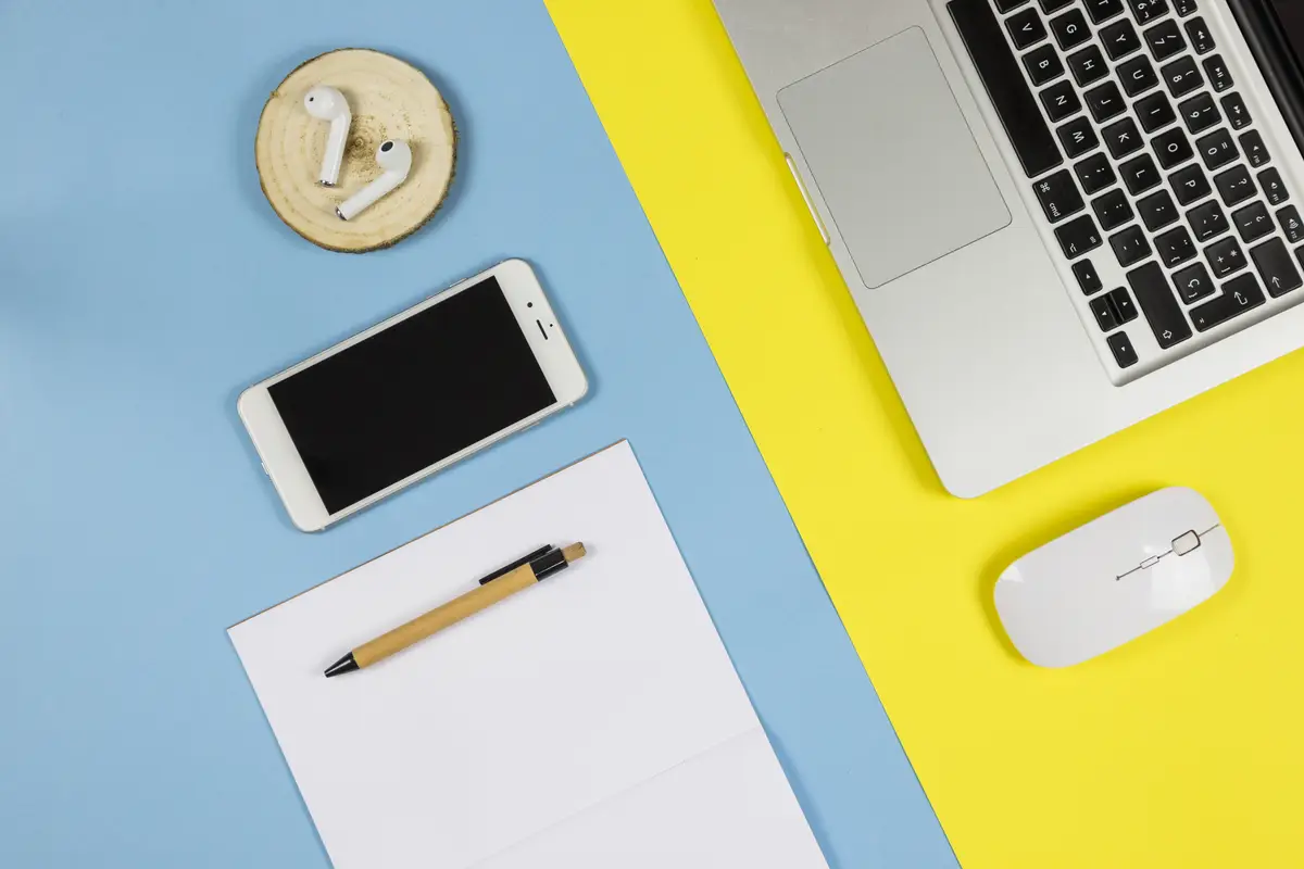 Smartphone with paper sheet and earphones 