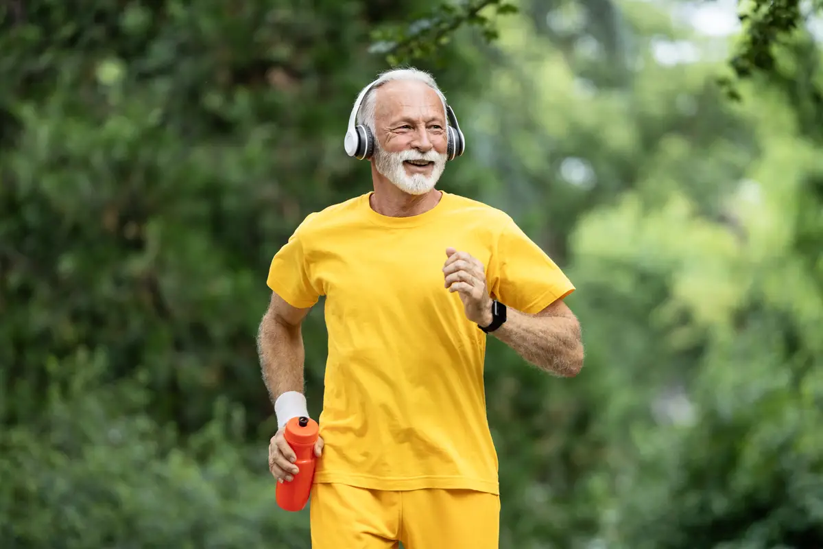 Active senior man running and training for good health