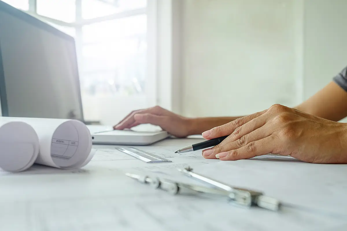 Hands of Engineer working on blueprint,Construction concept. Engineering tools.Vintage tone retro filter effect,soft focus(selective focus)
